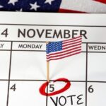 A calendar displaying the election date prominently, accompanied by the word "Vote" to encourage participation.